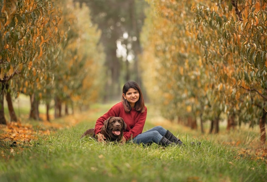 Perth woman with her chocolate labrador during photo shoot at Raeburn Orchards