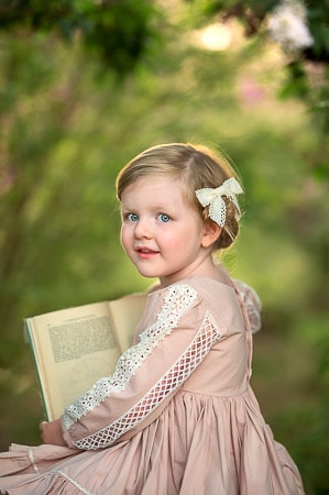 Perth girl holding a book during outdoor photoshoot