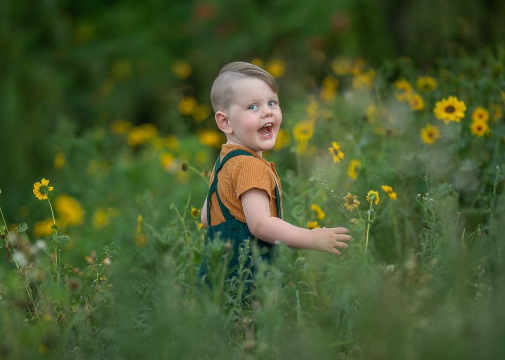 Perth toddler outdoors among the flowers
