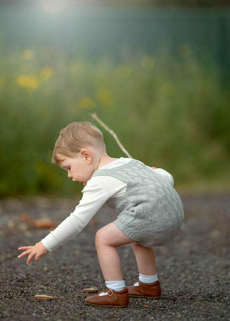 Perth Children Photographer - A toddler engaging with surroundings during outdoor photo shoot