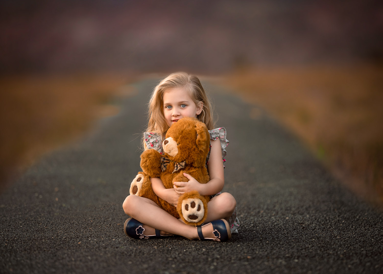 4 year old Perth girl holding teddy during outdoor photoshoot
