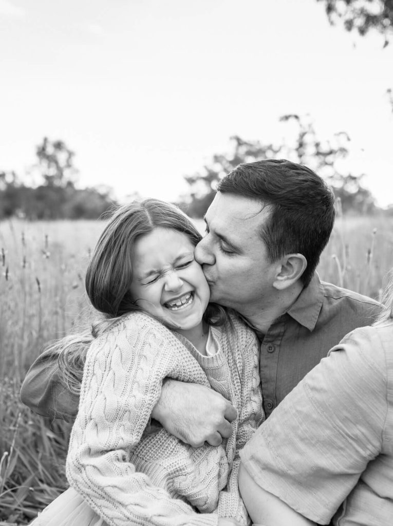 Perth Father and daughter hugging during outdoor family photo session