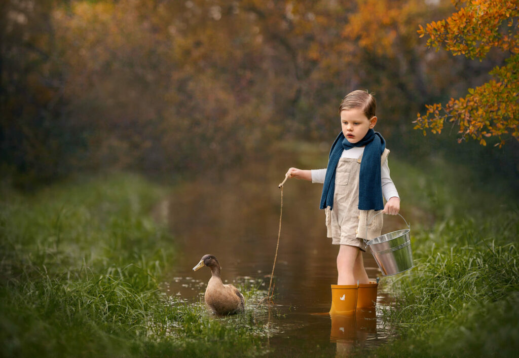 Perth toddler with pet duck during outdoor photoshoot