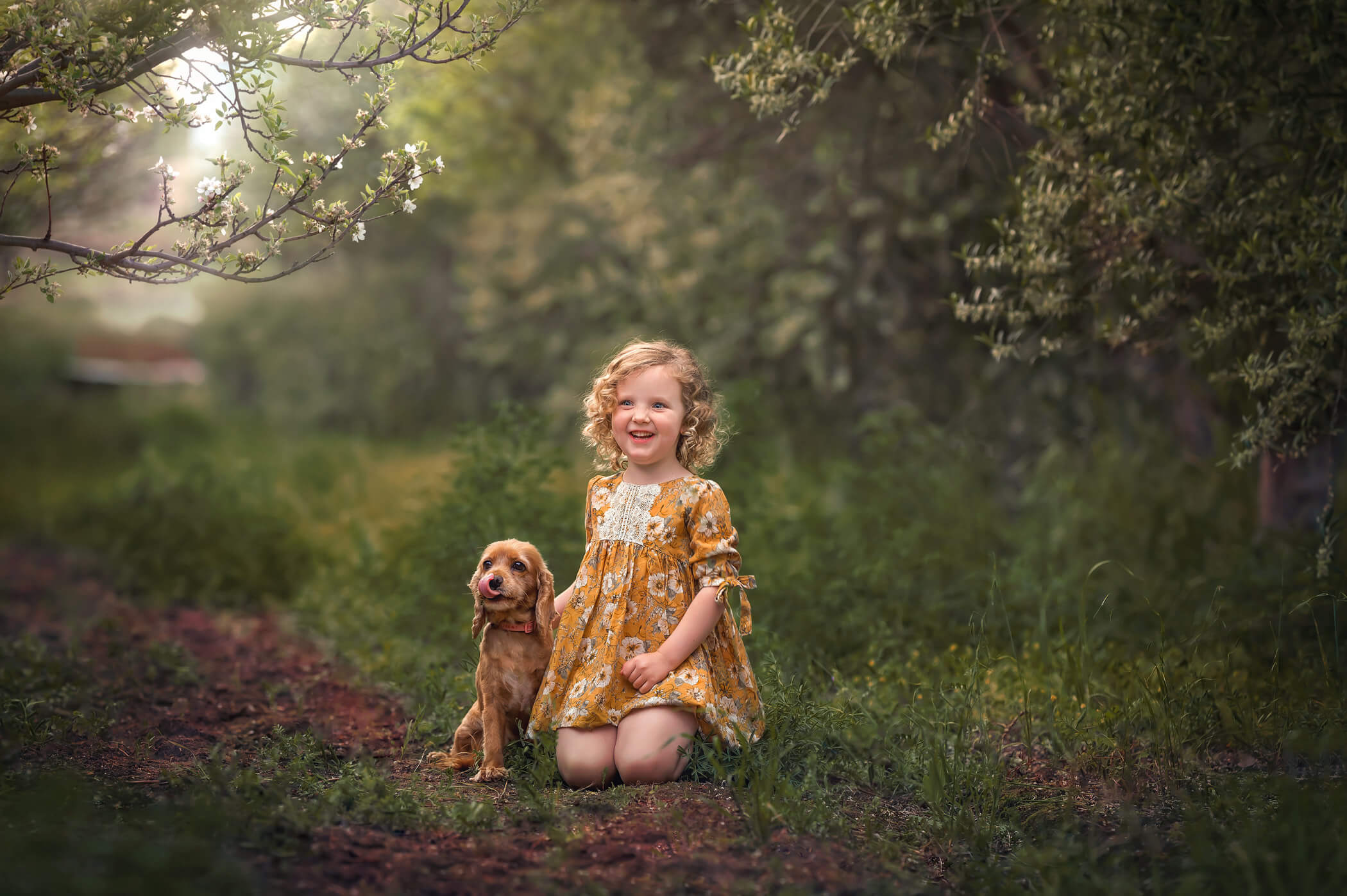 5 year old girl with her dog during outdoor photoshoot